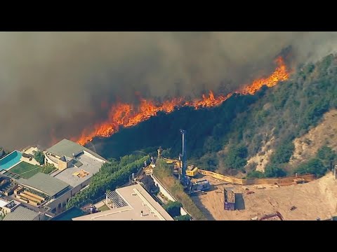 Fast-moving fire threatens Pacific Palisades homes